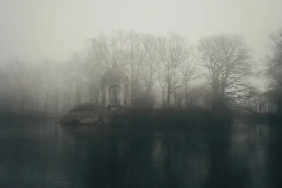 Fog covering an observation deck on a lake island.